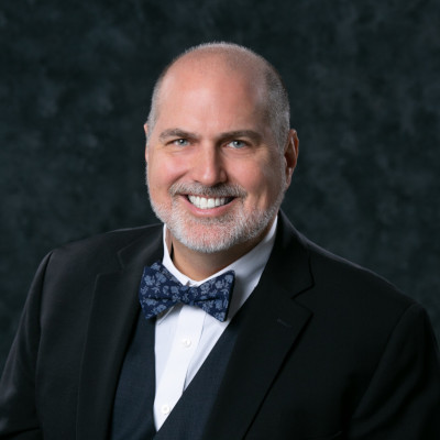 Headshot of Executive Director C. Joshua Villines.